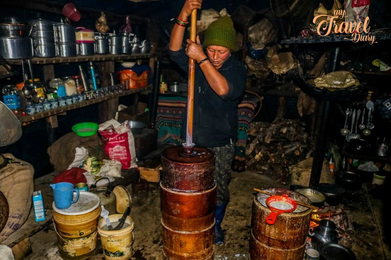 Brokpa woman making cheese, Tawang, Arunachal Pradesh. Visiting Brokpa settlements is one of the Offbeat experiences in Tawang