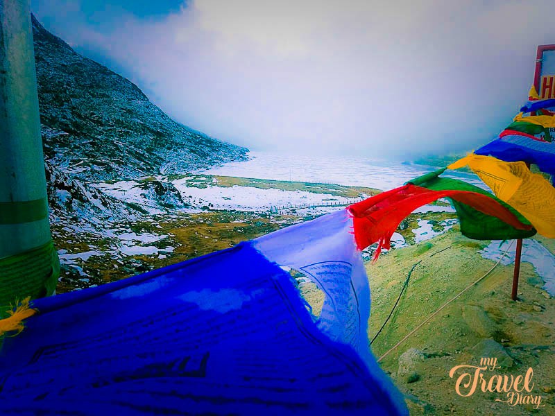 Colourful prayer flags at Sela Pass, Tawang, Arunachal Pradesh. Stand there to absorb the beauty is more than an offbeat experiences in Tawang