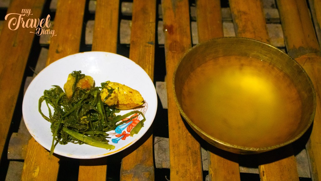 "Apong" (Locally brewed rice beer) served