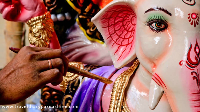 Artist painting Ganesha Idol