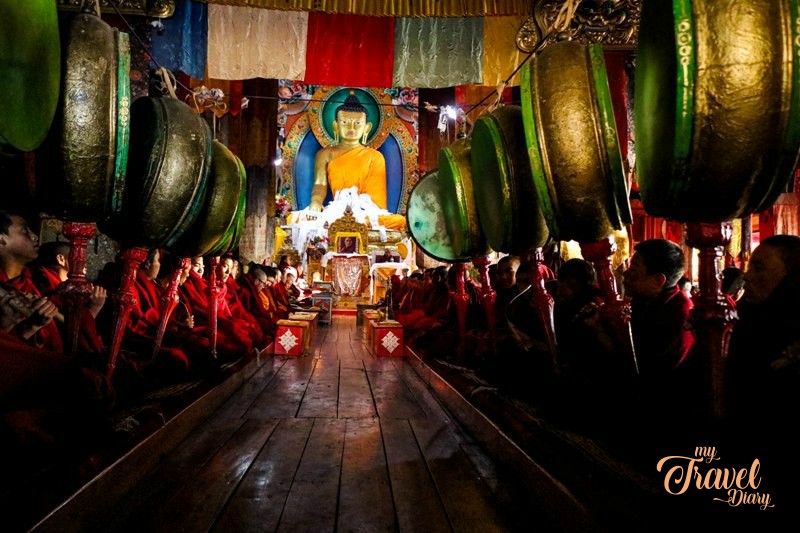 Monks during morning prayer session at Tawang monastery. Attending the morning prayer session is undoubtedly one of the Offbeat experiences in Tawang, Arunachal Pradesh