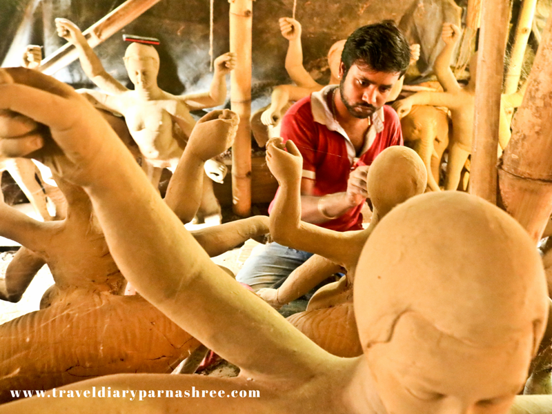 Artist painting clay idols